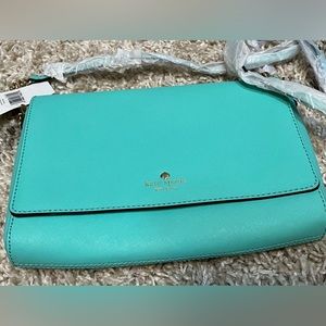 Bright turquoise Kate Spade purse.